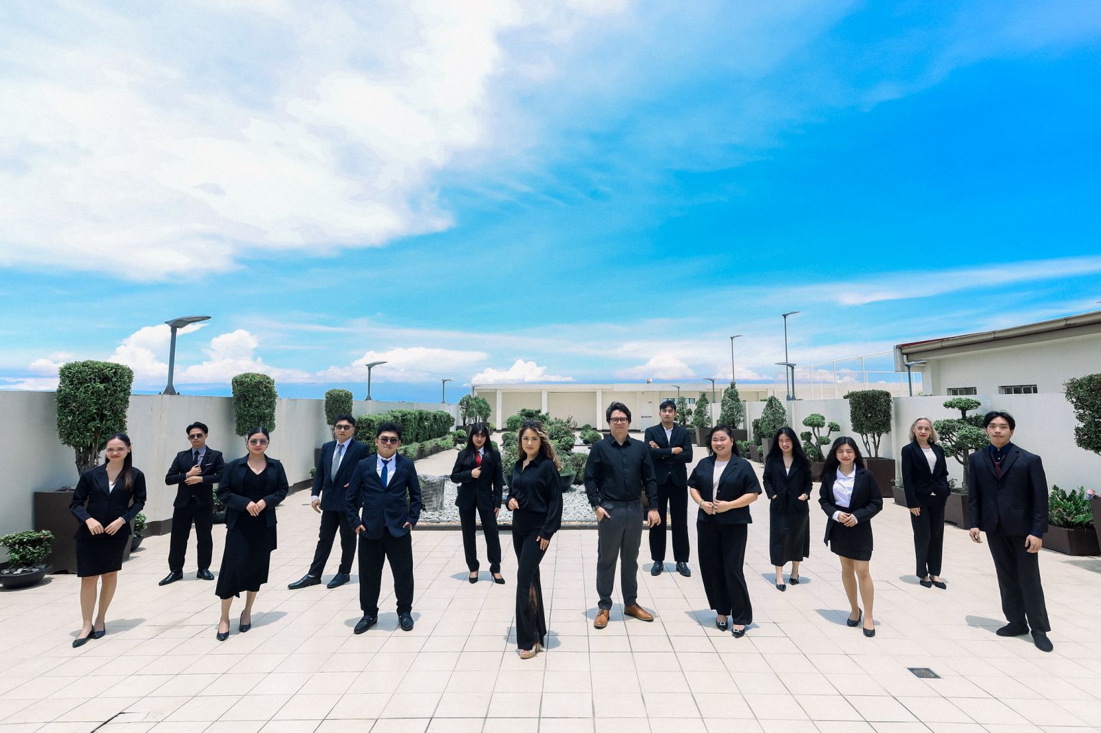 AMAC team gathered on a rooftop garden