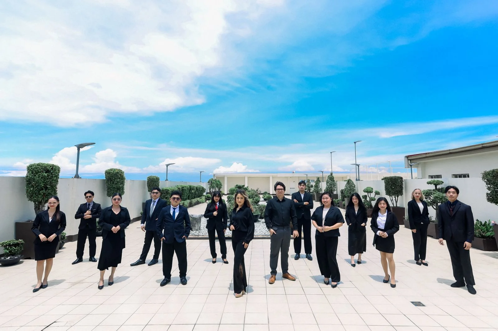 AMAC team gathered on a rooftop garden